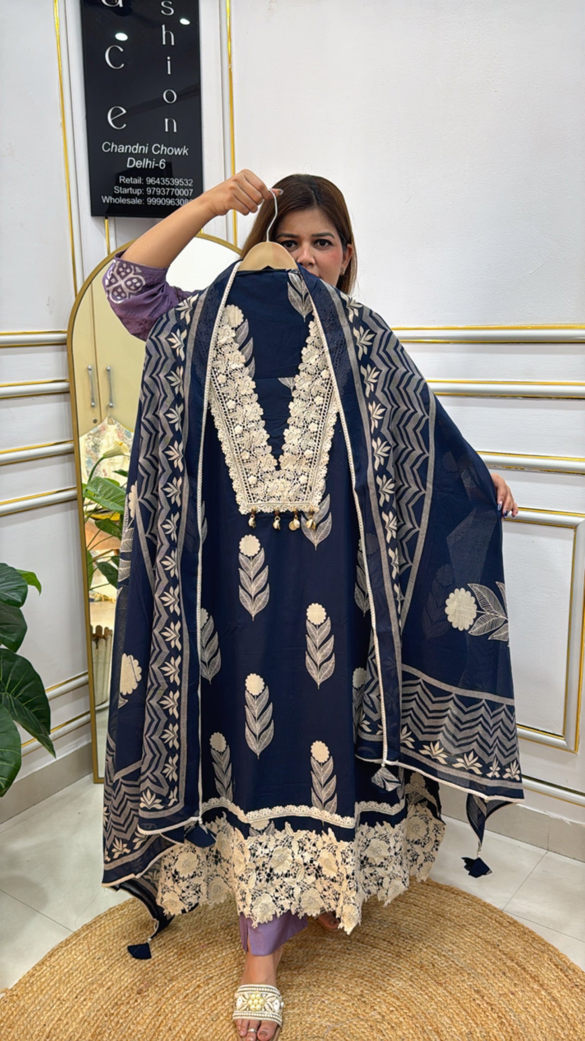 Elegant model showcasing a premium embroidered dupatta set in navy blue with intricate designs